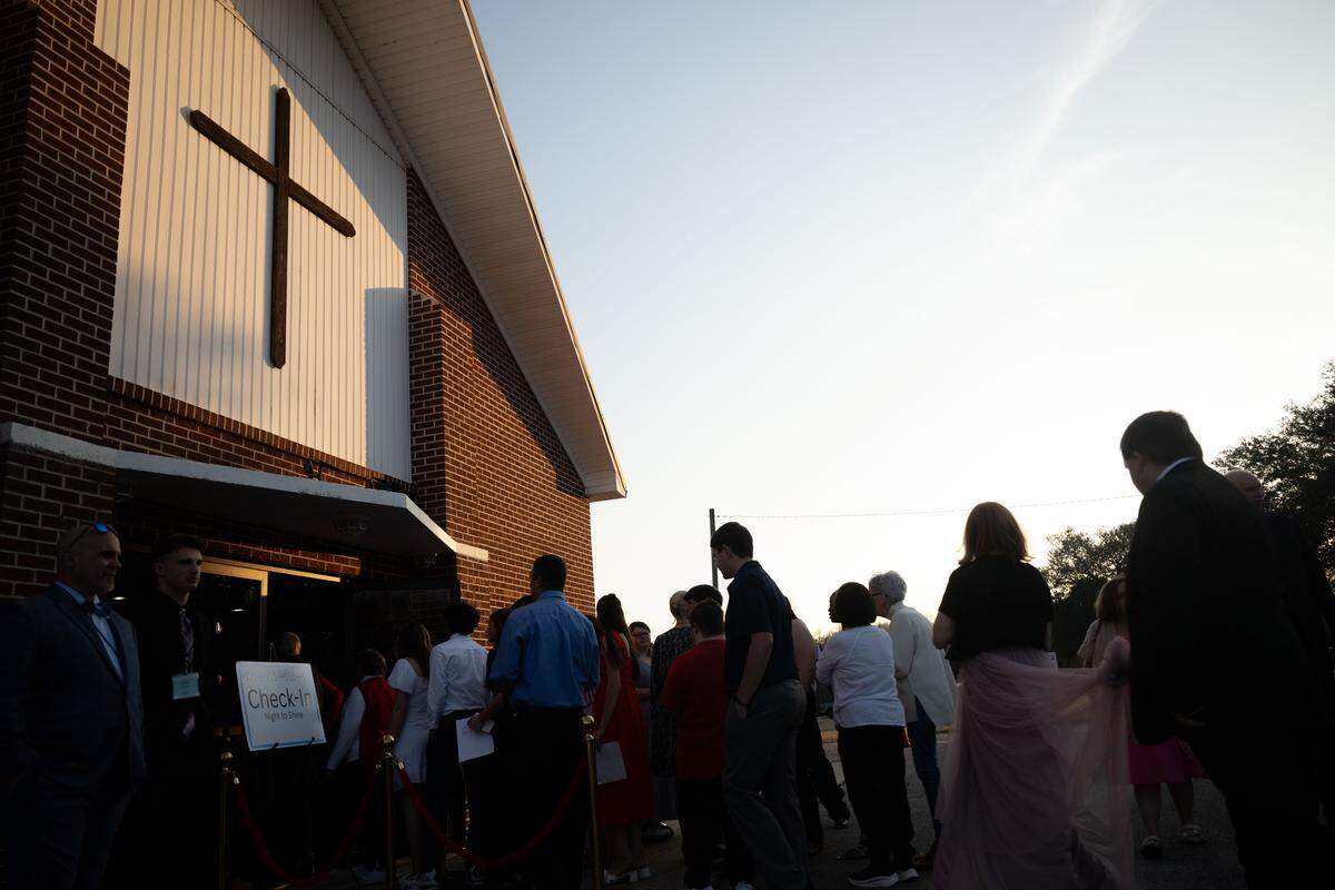 Volunteers and guests of honor line up outside Woolmarket Baptist Church during Night to Shine on Friday, Feb. 13, 2026.