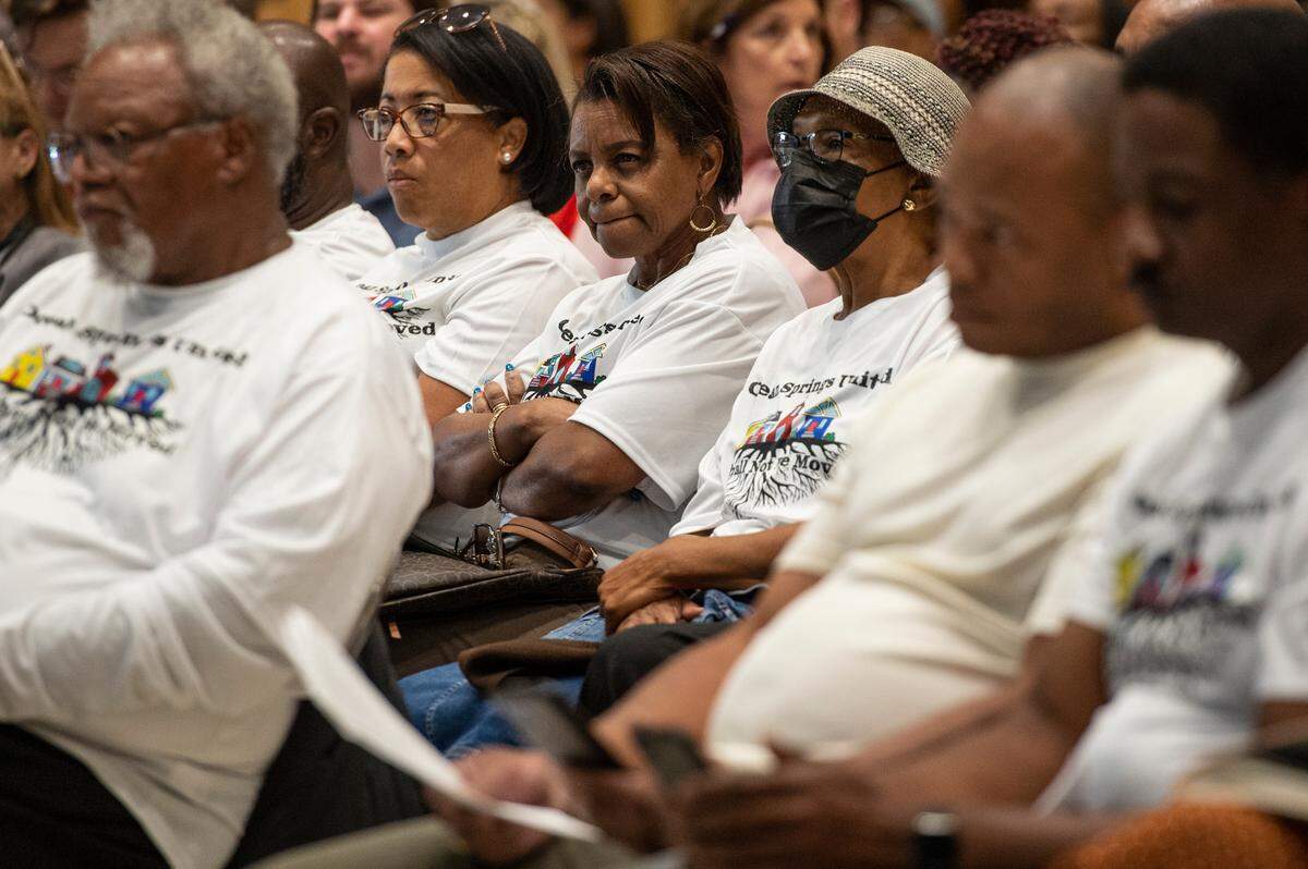 Ocean Springs residents and members of We Shall Not Be Moved, an organization opposed to a proposed Urban Renewal Plan, listen as residents voice their concerns about the plan and how it was communicated during a public hearing hosted by the mayor and Board of Aldermen at the Ocean Springs Civic Center on Monday, Oct. 2, 2023.