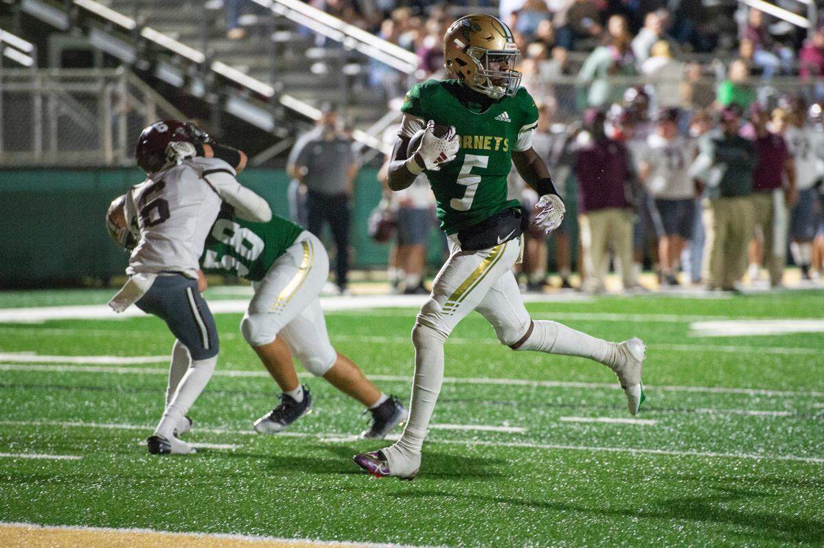 Poplarville’s Ty Keys runs the ball into the end zone for a touchdown during a playoff game against Forrest County Agricultural High School at Poplarville High School in Poplarville on Friday, Nov. 10, 2023.
