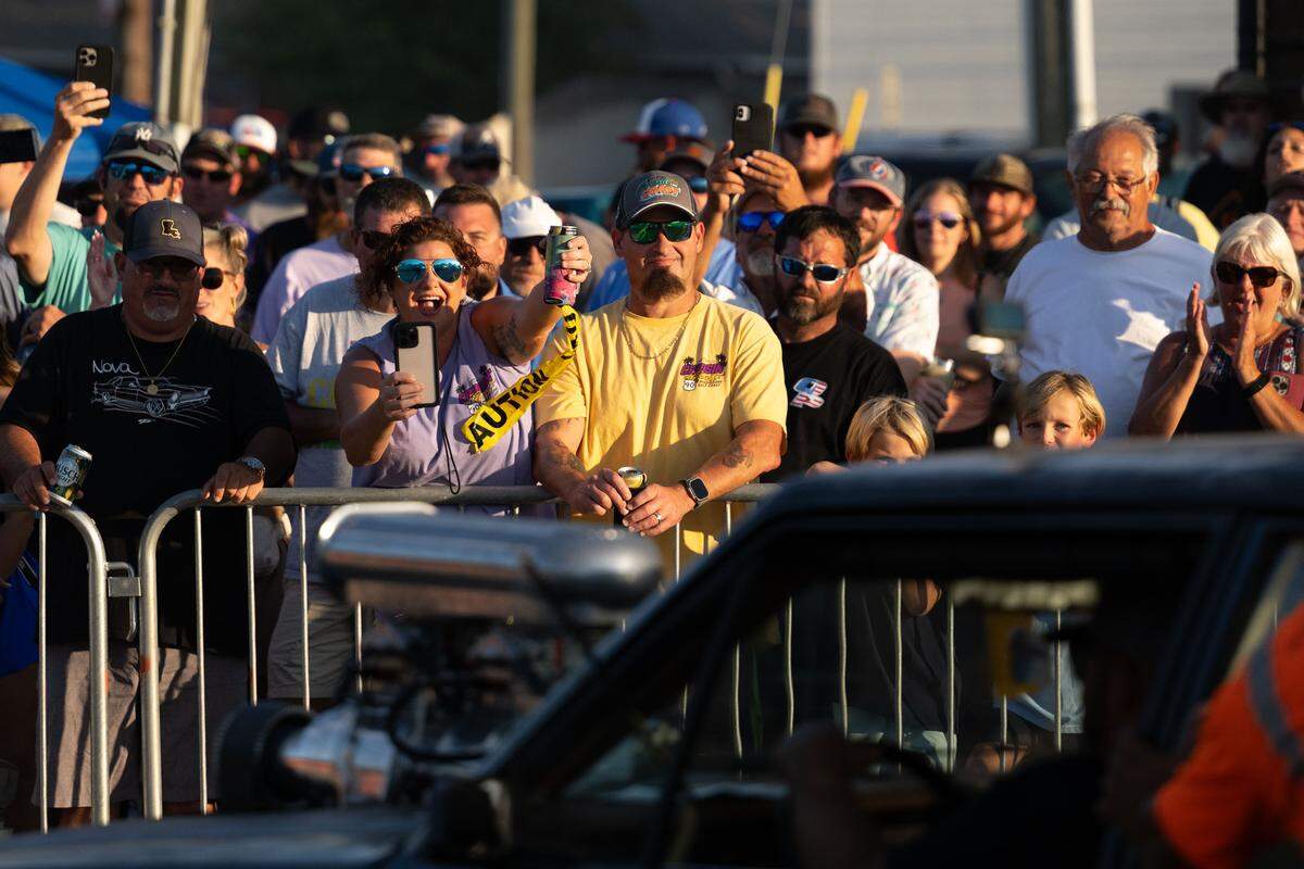 Crowd members cheer on a car during Burn ‘Em Up In The Pass on Thursday, Oct. 9, 2025.