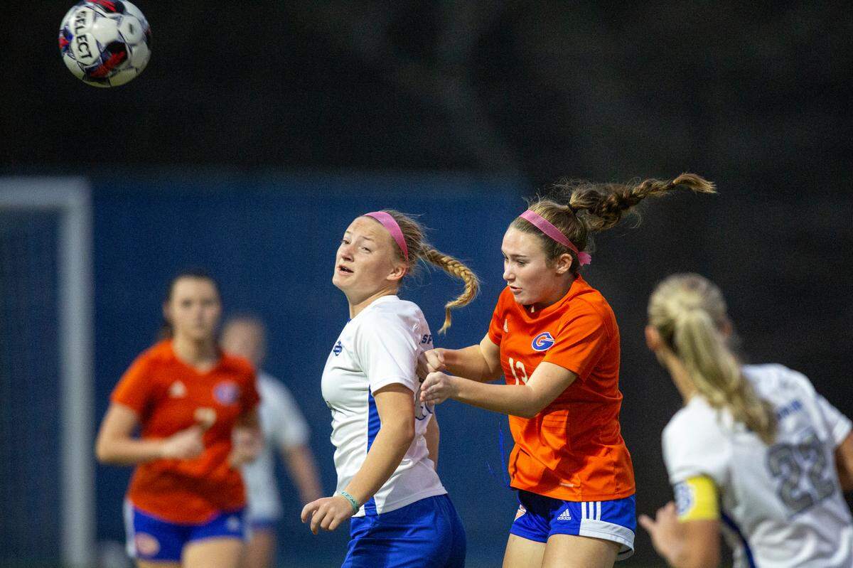 Gulfport’s Ansley Foster and Ocean Springs’ Jaylen Bodry go for a header during the 6A South State Championship game in Gulfport on Tuesday, Jan. 31, 2023.