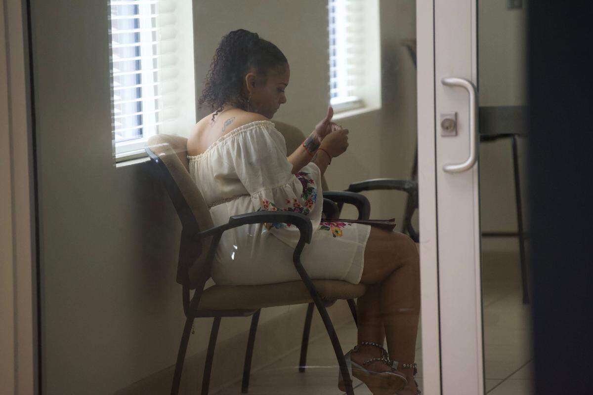 Kendra Shaffer, charged in the Carl the Rooster death, waits outside Ocean Springs Municipal Court Wednesday.