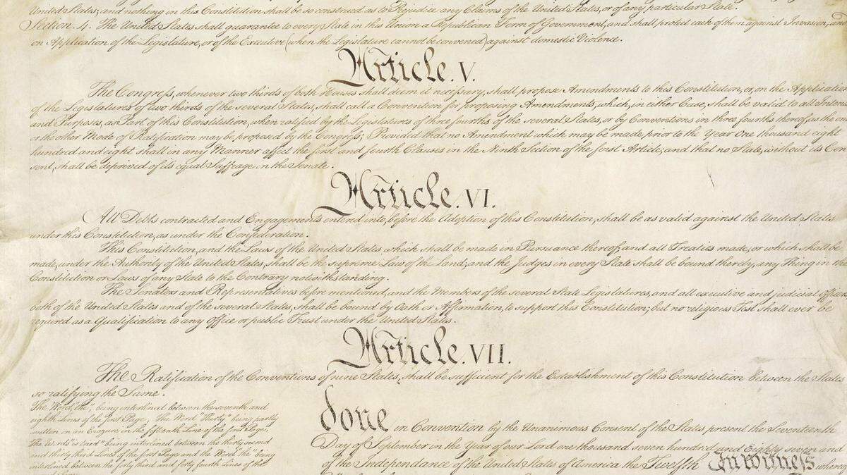 This photo made available by the U.S. National Archives shows a portion of the United States Constitution with Articles V-VII.