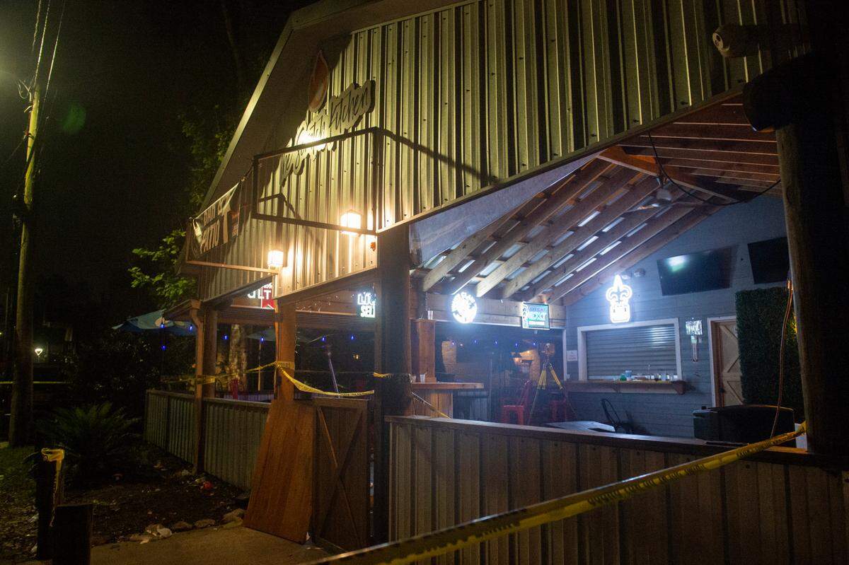 Crime scene tape surrounds The Scratch Kitchen restaurant in Ocean Springs after a shooting left 1 dead and several injured on Friday, May 5, 2023.