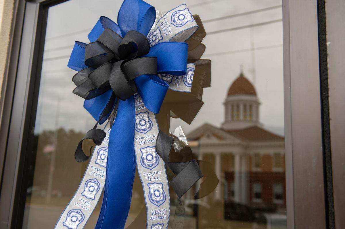Ribbons hang across from administrative buildings in Lucedale on Friday, Jan. 5, 2024, in honor of Jeremy Malone, an officer with the George County Sheriff’s Department that was killed on Thursday.