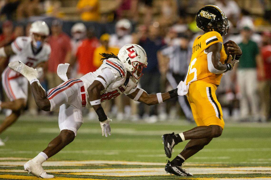 Southern Mississippi wide receiver Jakarius Caston (15) gets tackled by Liberty after making a catch during a NCAA college football game in Hattiesburg, Miss., Saturday, Sept. 3, 2022. Southern Mississippi lost 29-27