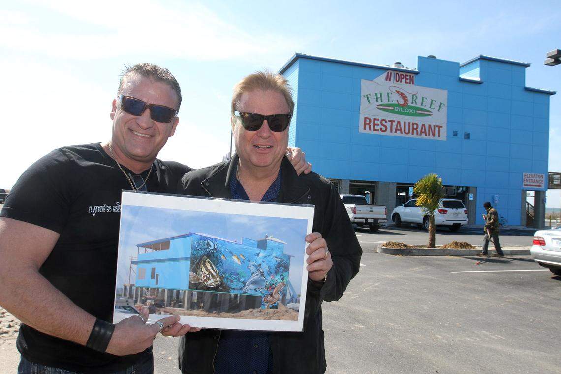 Artist Marty Wilson, left, and restauranteur Rob Stinson teamed up to create one the largest murals in the state at Stinson’s The Reef restaurant in Biloxi.
