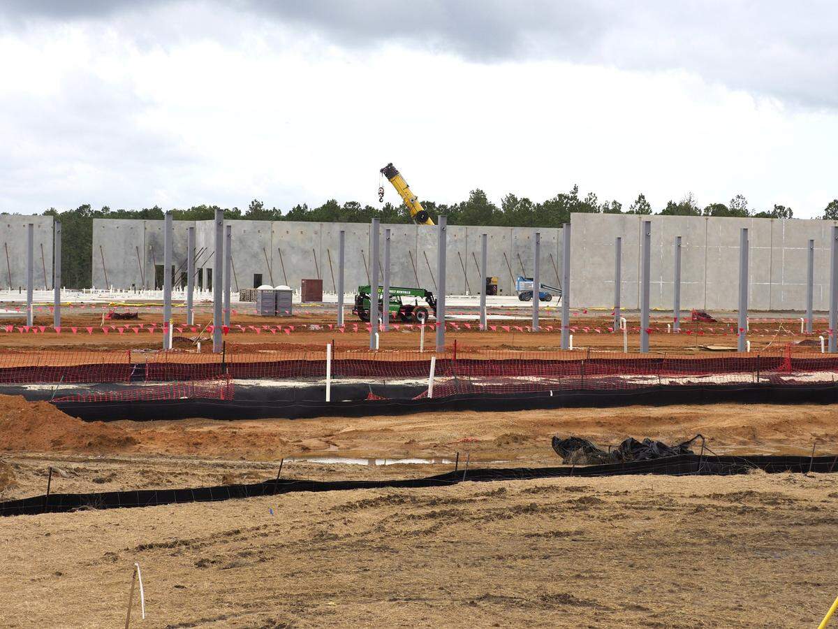 After just a couple days of work, real progress is seen at the new Buc-ee’s travel center on I-10, west of Gulfport. The pre-cast walls are delivered to the site and raised by crane.