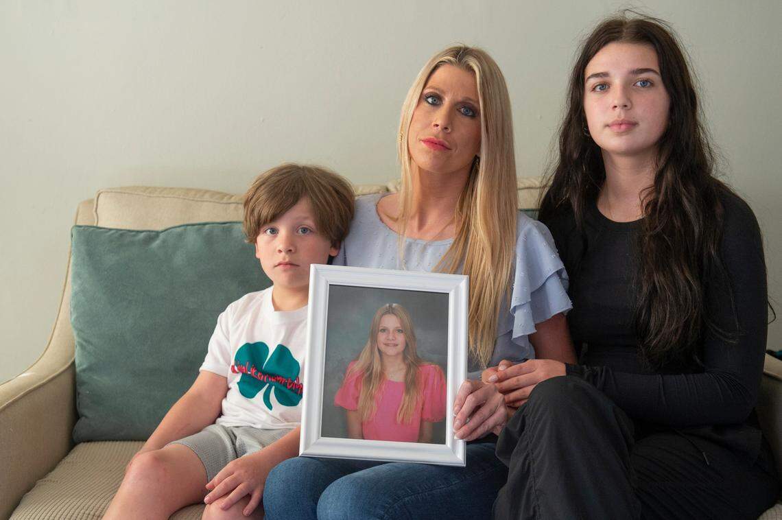 Heather Wyatt, center, and her children Taylor, 15, right, and Ryker, 6, at the Wyatt’s home in Ocean Springs on Tuesday, March 12, 2024. Heather and her children have been making TikTok’s and printing t-shirts to raise awareness for suicide and bullying prevention following Heather’s daughter Aubreigh’s death by suicide in 2023.