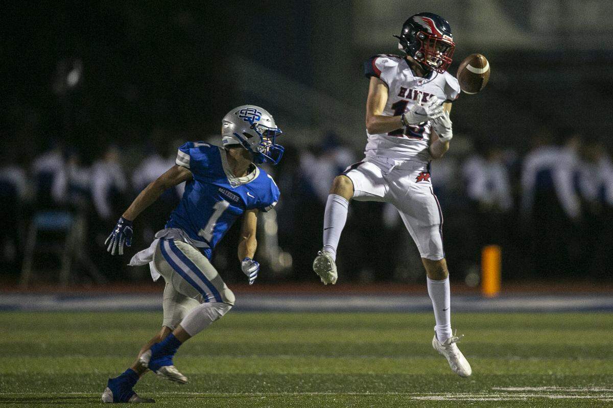 Hancock’s Todd Dedeaux makes a catch during the matchup between Ocean Springs and Hancock at Greyhound Stadium in Ocean Springs on Friday, Sept. 24, 2021.