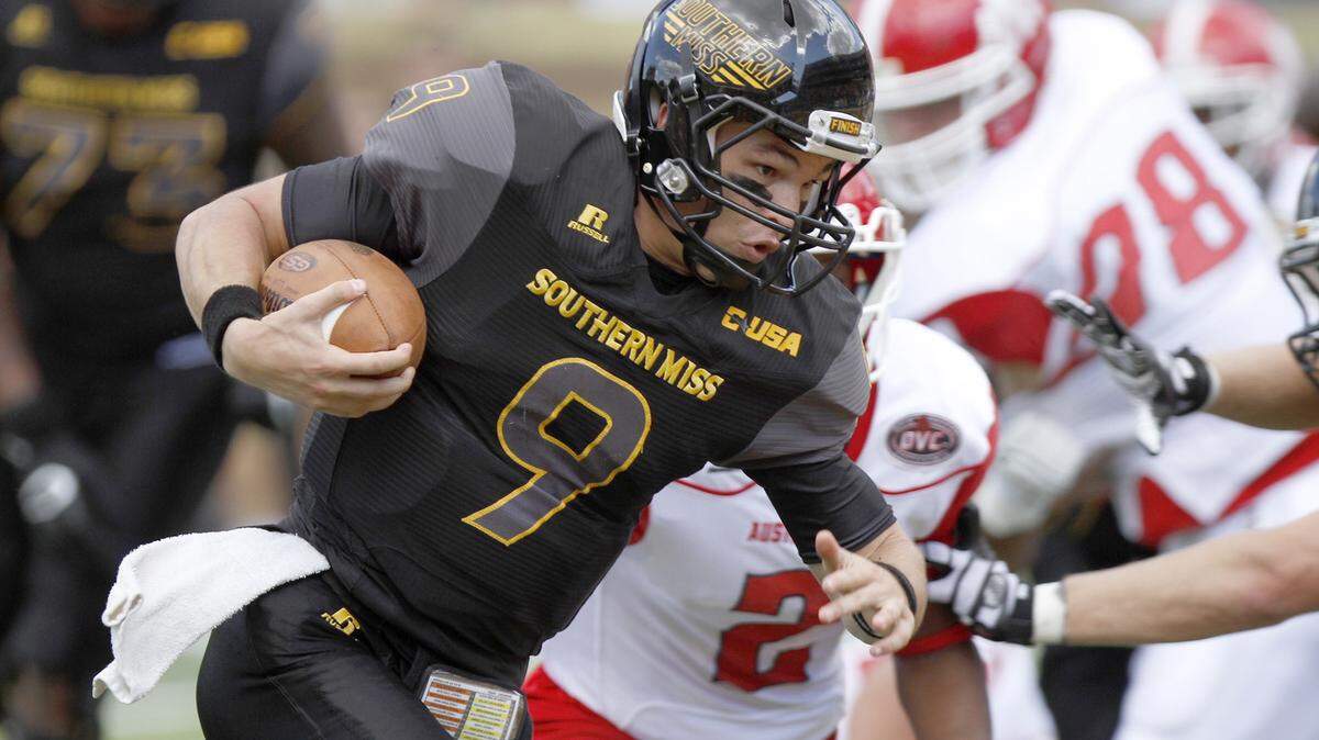 TIM ISBELL/SUN HERALDSouthern Miss quarterback Nick Mullens runs for a touchdown against Austin Peay on Sept. 12 in Hattiesburg.