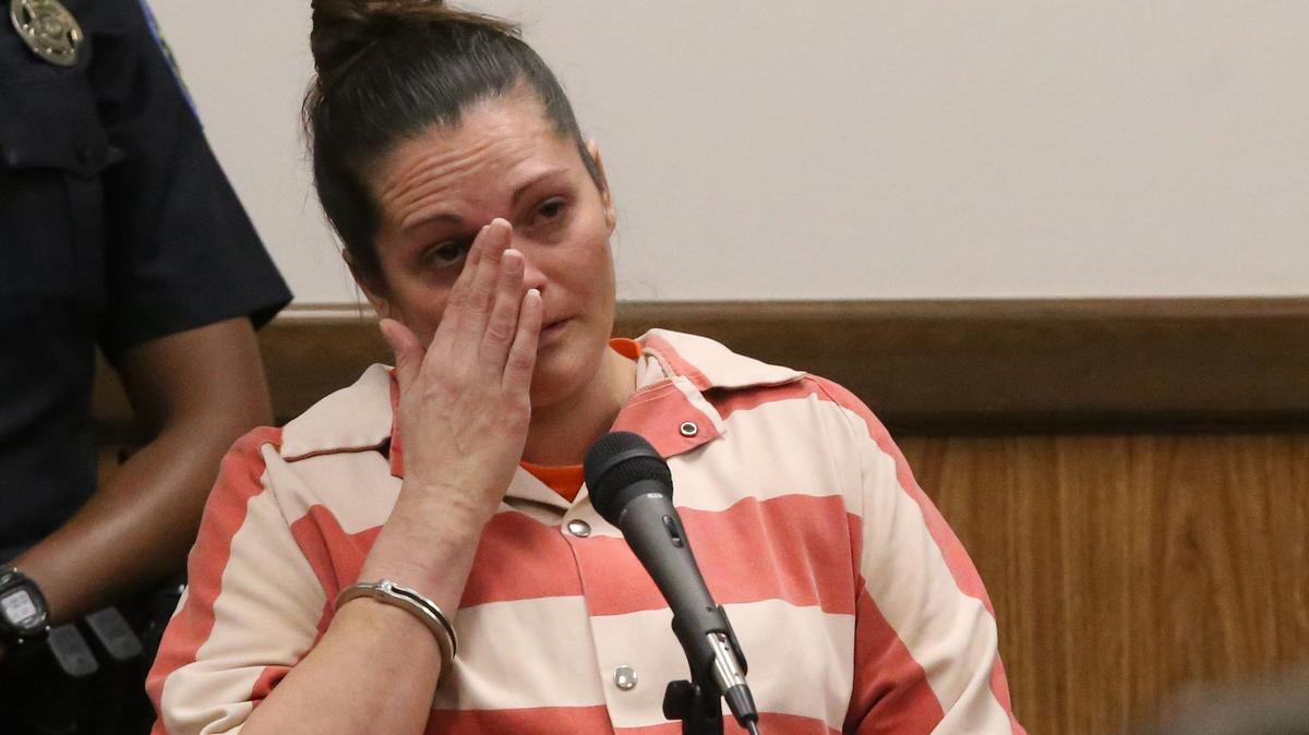 Kari Parker wipes a tear as she testifies on Wednesday, June 27, 2018, during Joshua Peterman's murder trial in Harrison County Circuit Court in Gulfport. Parker has pleaded guilty to second-degree murder in the death of Tena Marie Broadus in September 2015.