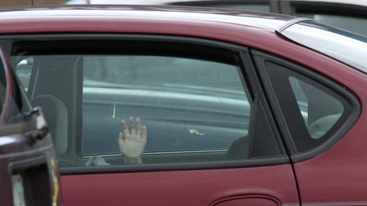 JOHN FITZHUGH/SUN HERALD/FILE 
 A child's hand reaches up after the child's caregiver had left several children unattended in her car in the parking lot of the Wal-Mart in D'Iberville in December 2007. The children were unhurt; the woman was arrested.