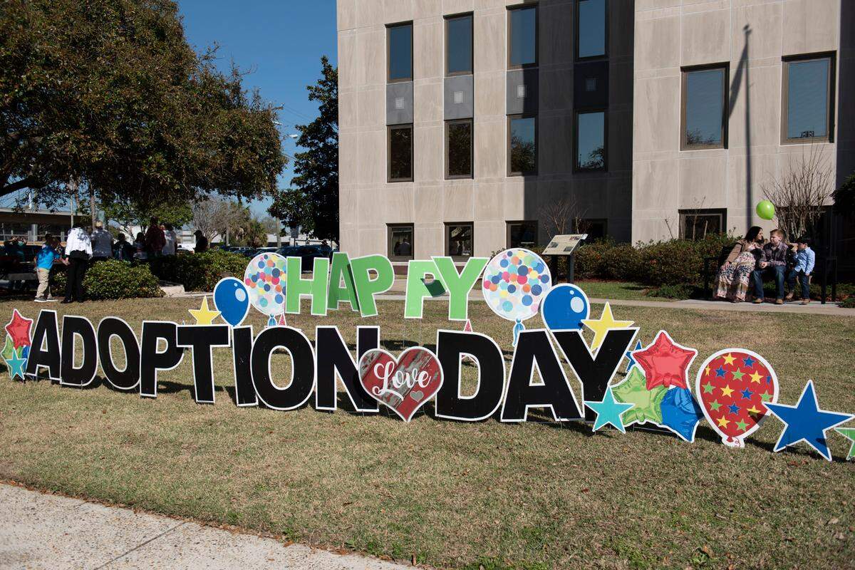 An adoption day sign outside the Jackson County Courthouse in Pascagoula on Thursday, March 10, 2022.