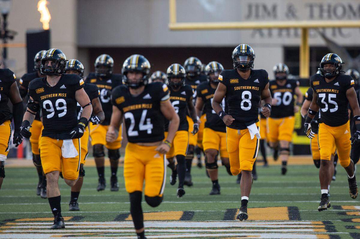 Southern Miss Golden Eagles run onto the field before a game against Arkansas State at M.M. Roberts Stadium in Hattiesburg on Saturday, Oct. 15, 2022.