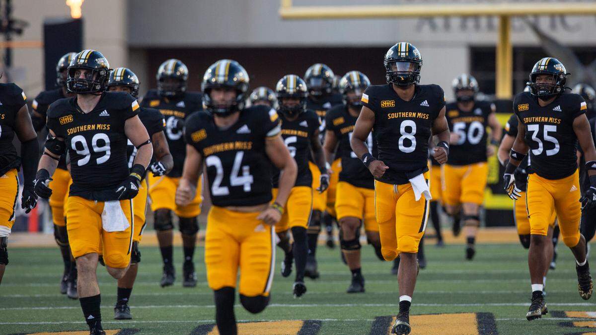 Southern Miss Golden Eagles run onto the field before a game against Arkansas State at M.M. Roberts Stadium in Hattiesburg on Saturday, Oct. 15, 2022.