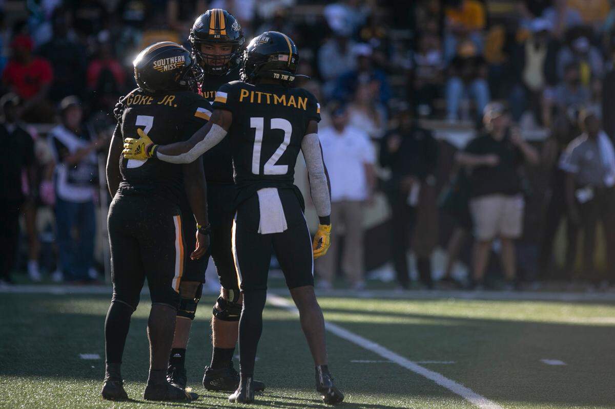 Southern Miss’s Chandler Pittman comforts Frank Gore Jr. during the game against the University of Alabama-Birmingham Blazers at M.M. Roberts Stadium in Hattiesburg on Saturday, Oct. 16, 2021.