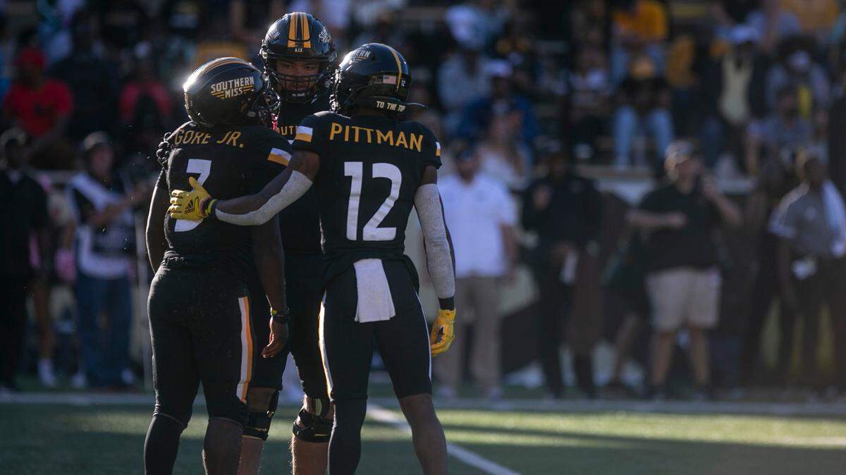 Southern Miss’s Chandler Pittman comforts Frank Gore Jr. during the game against the University of Alabama-Birmingham Blazers at M.M. Roberts Stadium in Hattiesburg on Saturday, Oct. 16, 2021.
