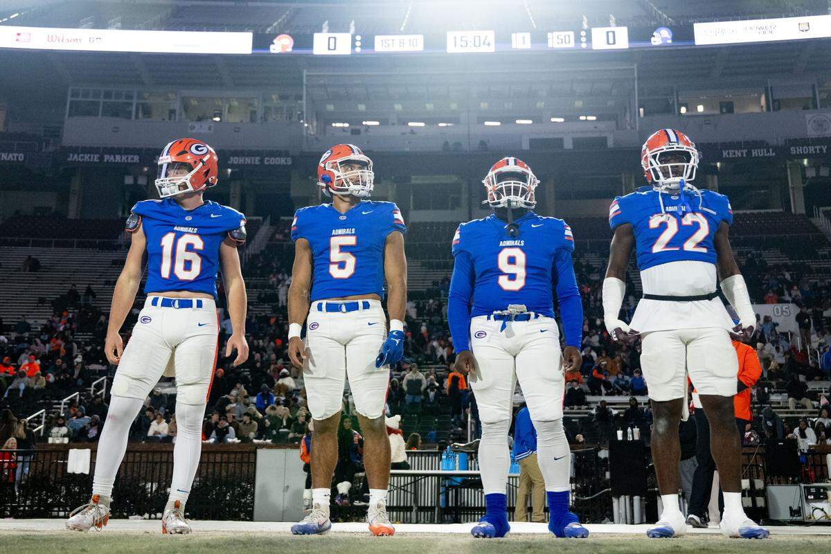Gulfport team captains line up at midfield for the coin toss in advance of the Class 7A state title game.