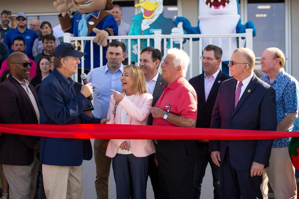 Biloxi’s leaders prepare to cut the ribbon for the grand opening of Paradise Pier at Margaritaville in Biloxi on Friday, March 3, 2023.