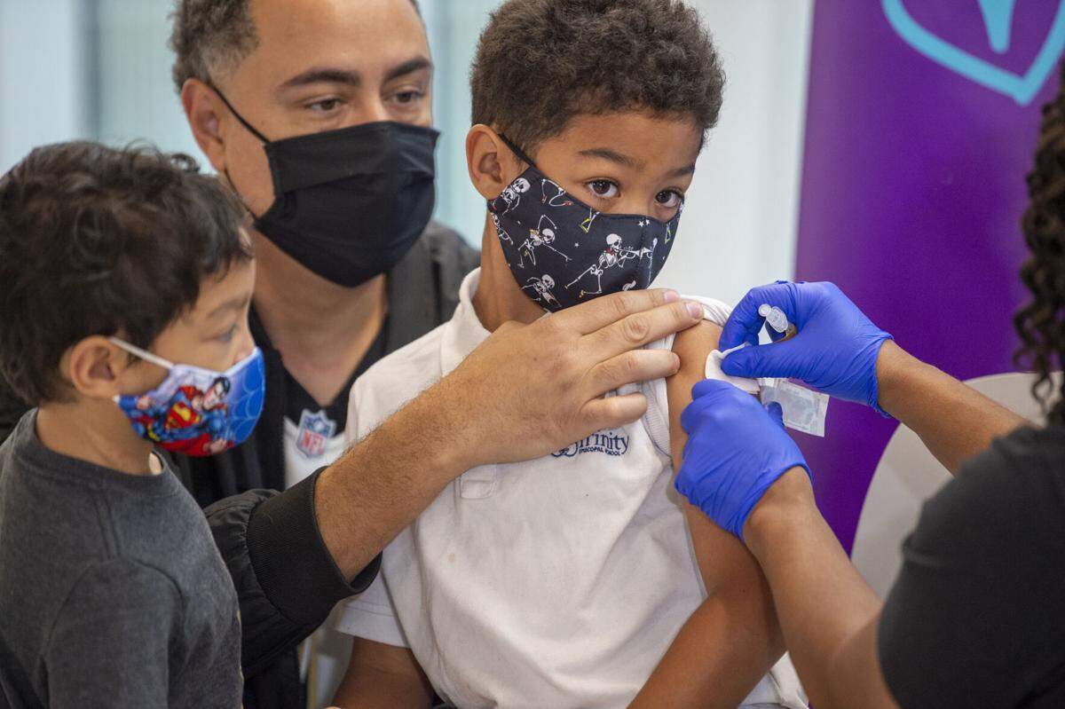 A child receives a COVID-19 vaccine at Children’s Hospital in New Orleans.