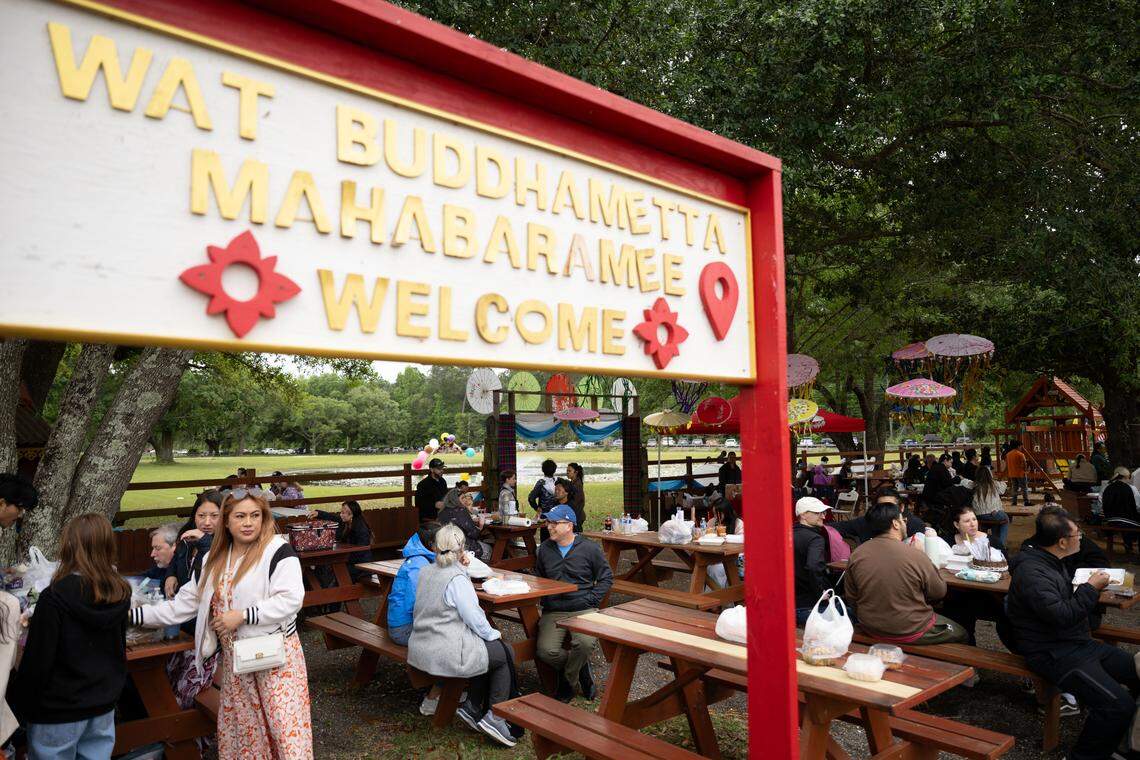 Hundreds of people sit down to eat during Songkran at the Wat Buddhametta Mahabaramee in Gautier on Sunday, April 19, 2026.