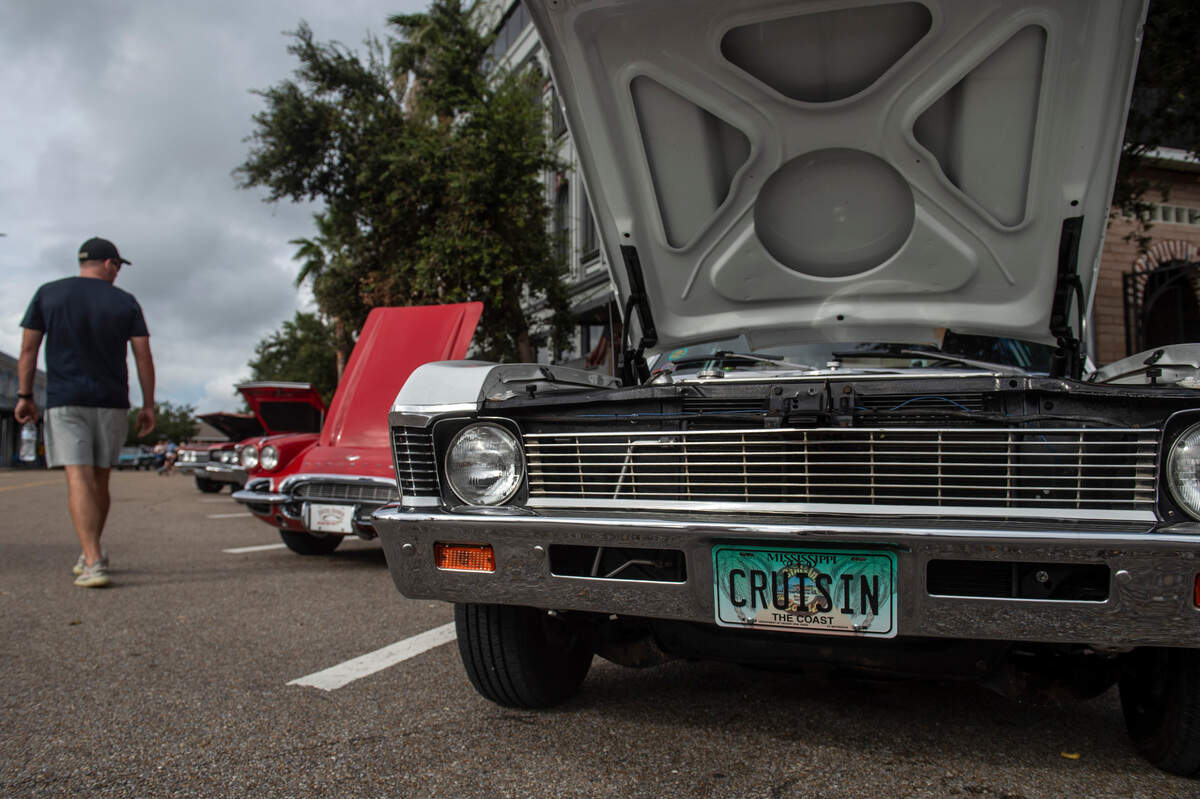 Visitors look at collector cars during View the Cruise on Sunday, Oct. 3, 2021.