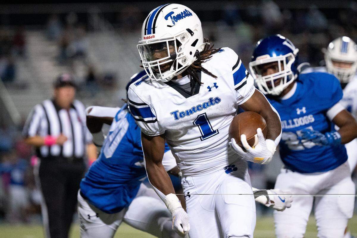 Stone running back Ayden Green (1) picks up yards Friday in the Tomcats’ win over Vancleave.