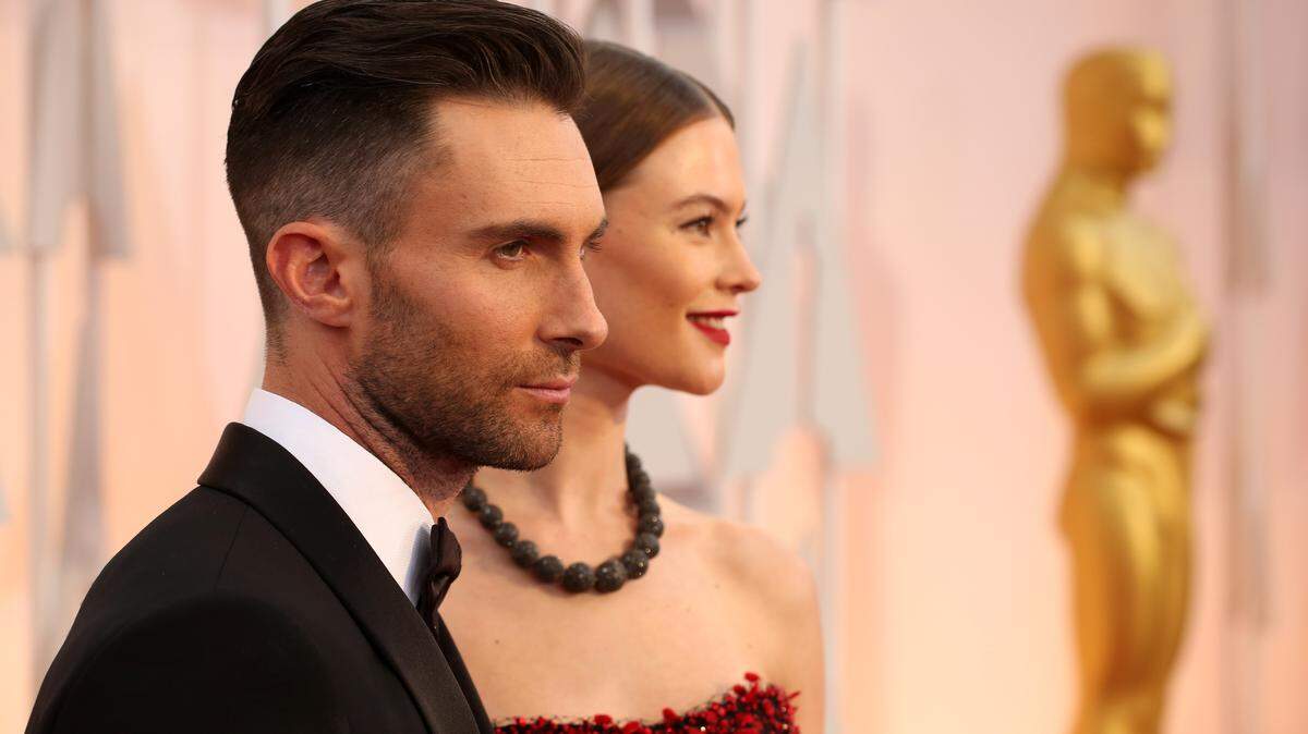 Adam Levine, left, and Behati Prinsloo arrive at the Oscars on Sunday, Feb. 22, 2015, at the Dolby Theatre in Los Angeles. (Photo by Matt Sayles/Invision/AP)