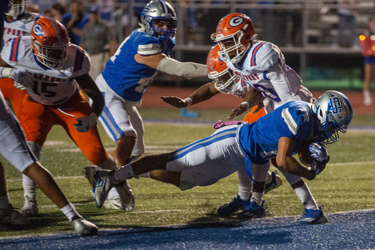 Ocean Springs’ Will Gray scores a touchdown during a game against Gulfport at Greyhound Stadium in Ocean Springs on Friday, Oct. 28, 2022.