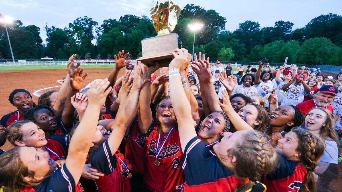 BOB SMITH/SPECIAL TO THE SUN HERALD/2015Harrison Central players celebrate with their trophy following their 9-1 win over Madison Central in the 2015 MHSAA 6A Girls Softball Championship in Ridgeland. Harrison Central will play Ocean Springs in the second round of the Class 6A playoffs.