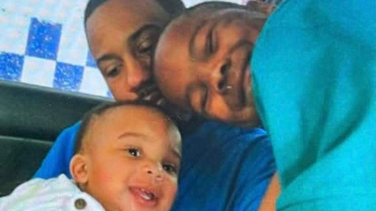 Marcus Taylor is seen here in a photo taken after church in 2012 or 2013 with his son, Blakeland, then age 1, and stepson, Joshua, then age 6.
