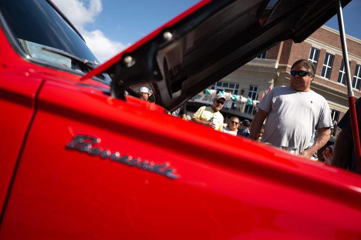 Event attendees check out cars Wednesday at the Biloxi Block Party.