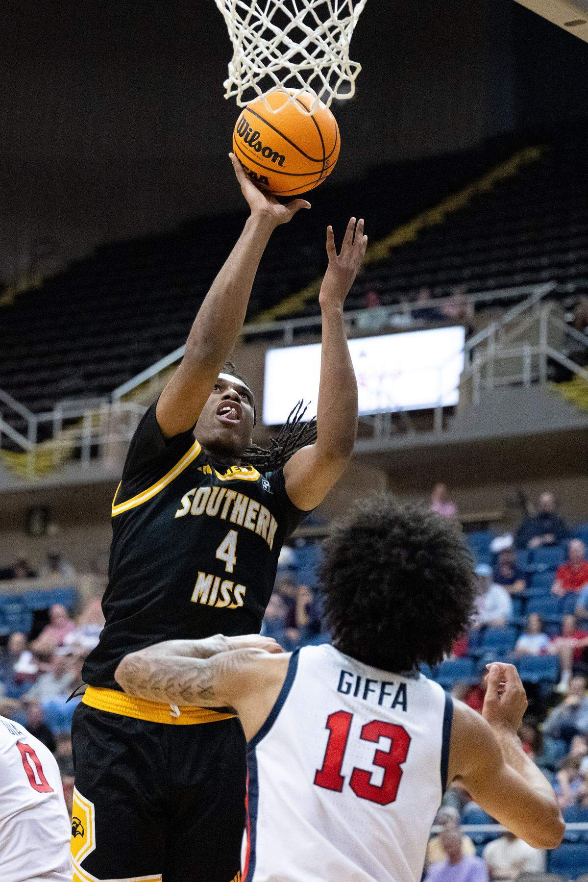 Southern Mississippi forward Tylik Weeks (4) takes a shot at the basket.