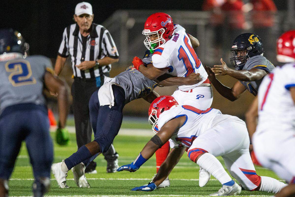 Pascagoula’s Cameron Deflanders gets tackled by Gautier’s Monyeh Boykin during a game at Gautier High School in Gautier on Friday, Sept. 2, 2022.