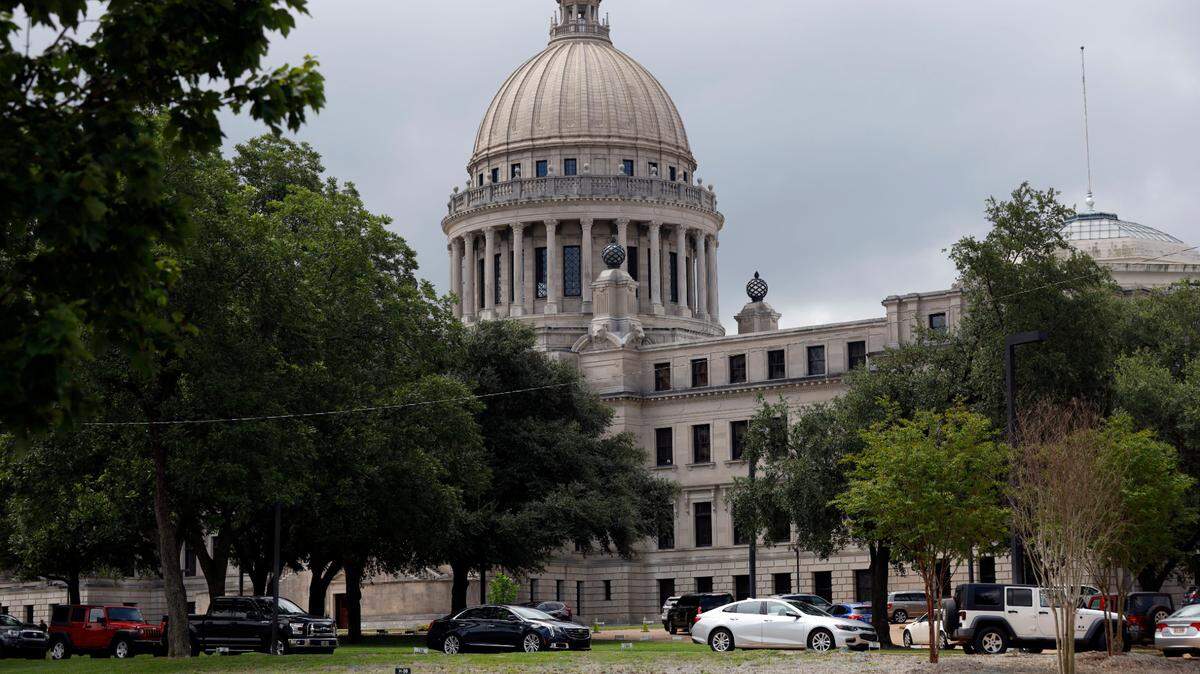 Mississippi legislators, staff and Capitol employees take advantage of a drive-thru COVID-19 testing center on the Capitol grounds in Jackson, Miss., Monday, July 6, 2020, following an incidence at the Mississippi Legislature. House Speaker Philip Gunn confirmed Sunday that he had recently tested positive for COVID-19.