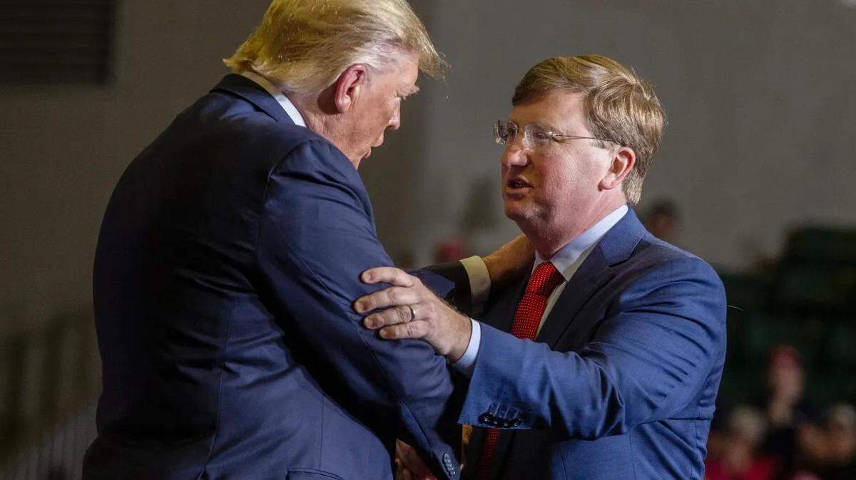 President Donald Trump embraces Lt. Gov. Tate Reeves during a 2019 campaign rally in Tupelo.
