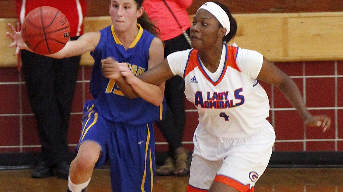 TIM ISBELL/SUN HERALD 
 Bay High's Breanna Fountain tries to beat Gulfport's Quentella Johnson to the ball during game at Biloxi High, Thursday, Nov. 12, 2015.