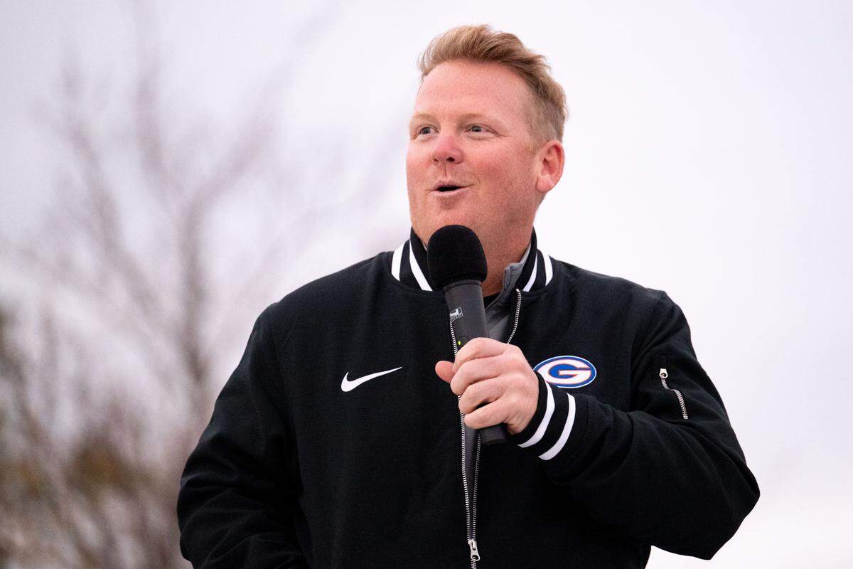 Gulfport head football coach Blake Pennock addresses the crowd during the Champions Christmas Parade in Gulfport on Monday, Dec. 8, 2025.