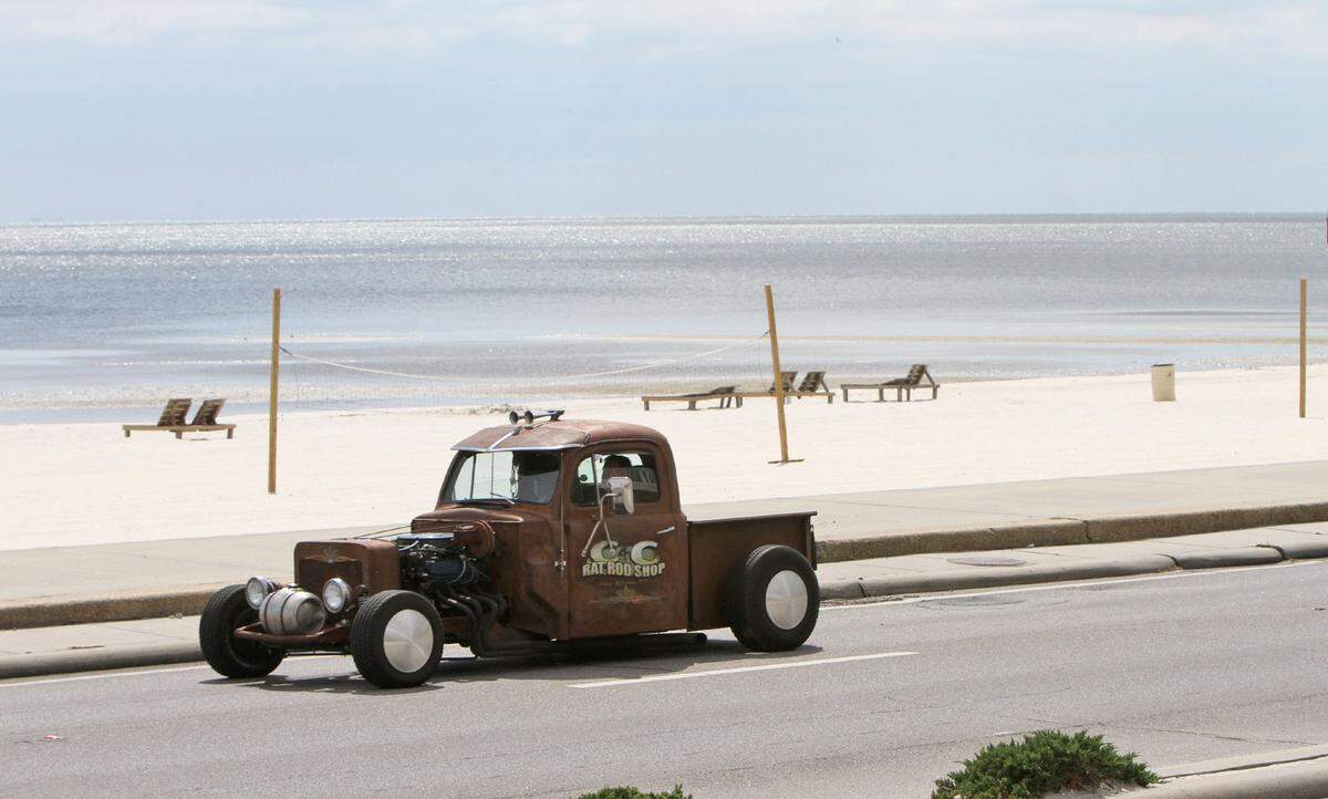 The combination of the beach and the cars and trucks, including this rat rod rolling down U.S. 90 in Gulfport, draws 10,000 registered vehicles and thousands of their fans to Cruisin’ The Coast each year.
