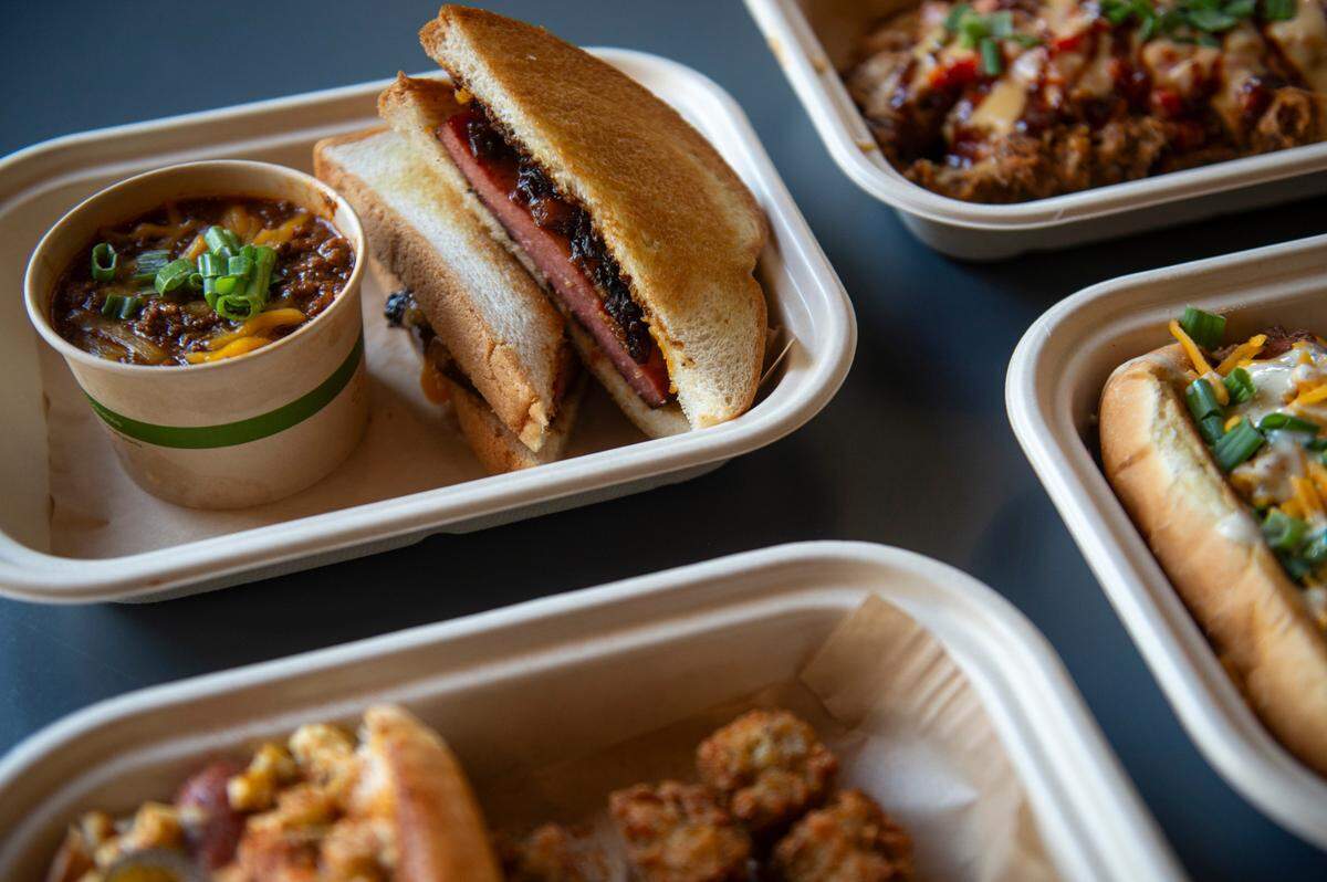 The fried bologna sandwich, left, at The Garage at Cash Alley in Ocean Springs on Friday, Dec. 13, 2024.