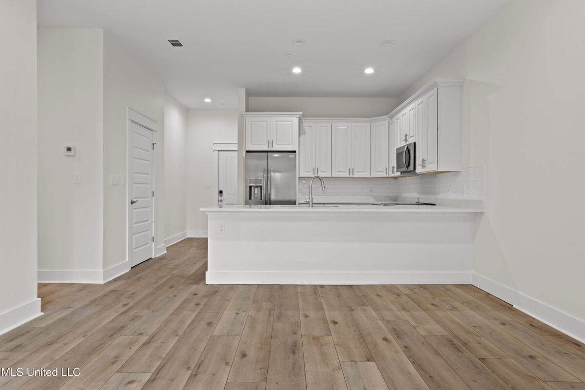 A large eating counter and upscale fixtures are popular features built into the kitchens at the new 124 Court Condominiums in downtown Bay St. Louis