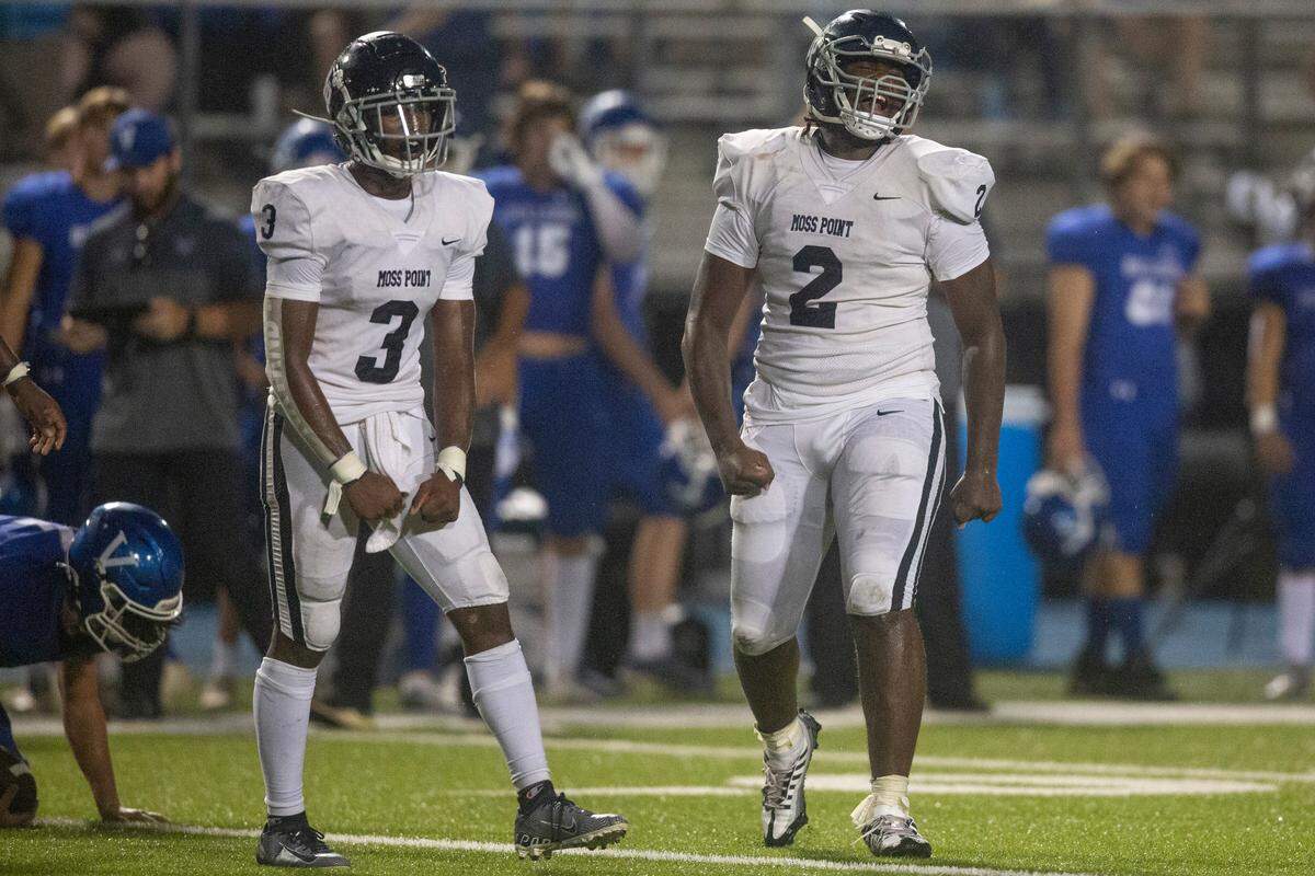 Moss Point’s Jamarious Brown (2) and Taboris Charles (3) celebrate after a turnover during a game against Vancleave at Vancleave Football Stadium in Vancleave on Friday, Sept. 9, 2022.