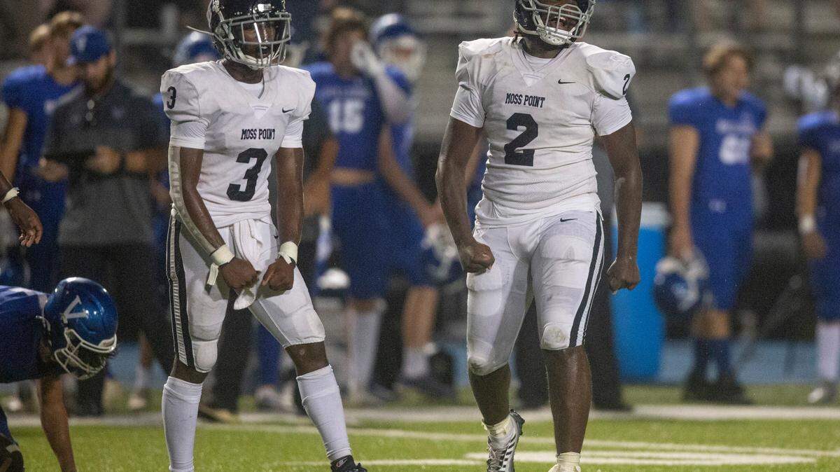 Moss Point’s Jamarious Brown (2) and Taboris Charles (3) celebrate after a turnover during a game against Vancleave at Vancleave Football Stadium in Vancleave on Friday, Sept. 9, 2022.