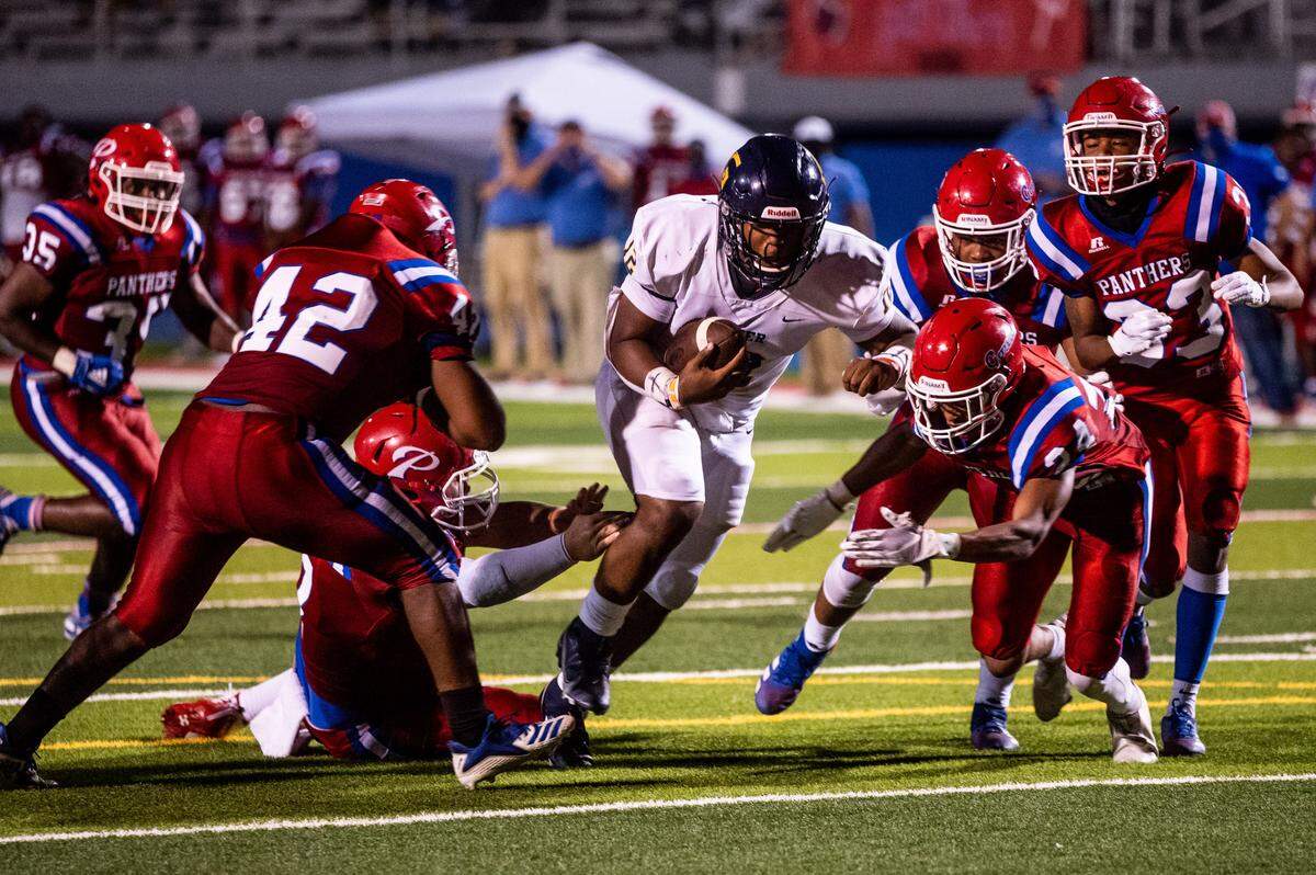 Kaden Irving, a sophomore quarterback for the Gautier Gators, busts through the Pascagoula defensive line for a touchdown in Gautier’s 43-20 victory over the Panthers on Oct. 8, 2020.