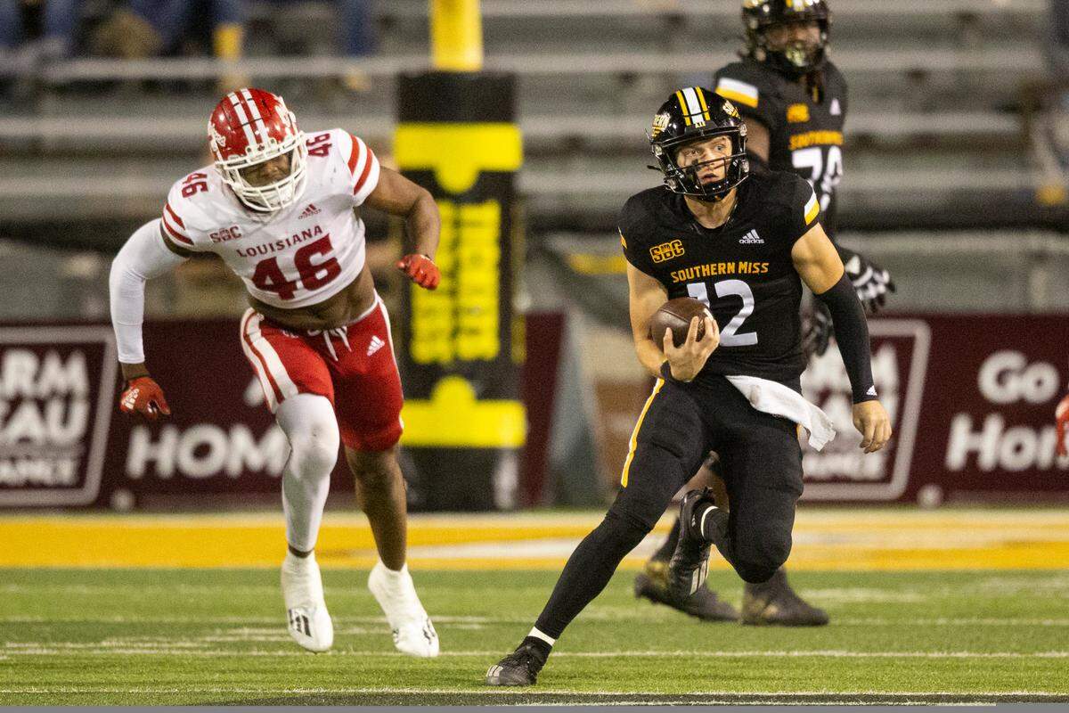 Southern Mississippi quarterback Zach Wilcke (12) runs the ball during the second half of an NCAA college football game in Hattiesburg, Miss., Thursday, Oct. 27, 2022. (Hannah Ruhoff/The Sun Herald via AP)