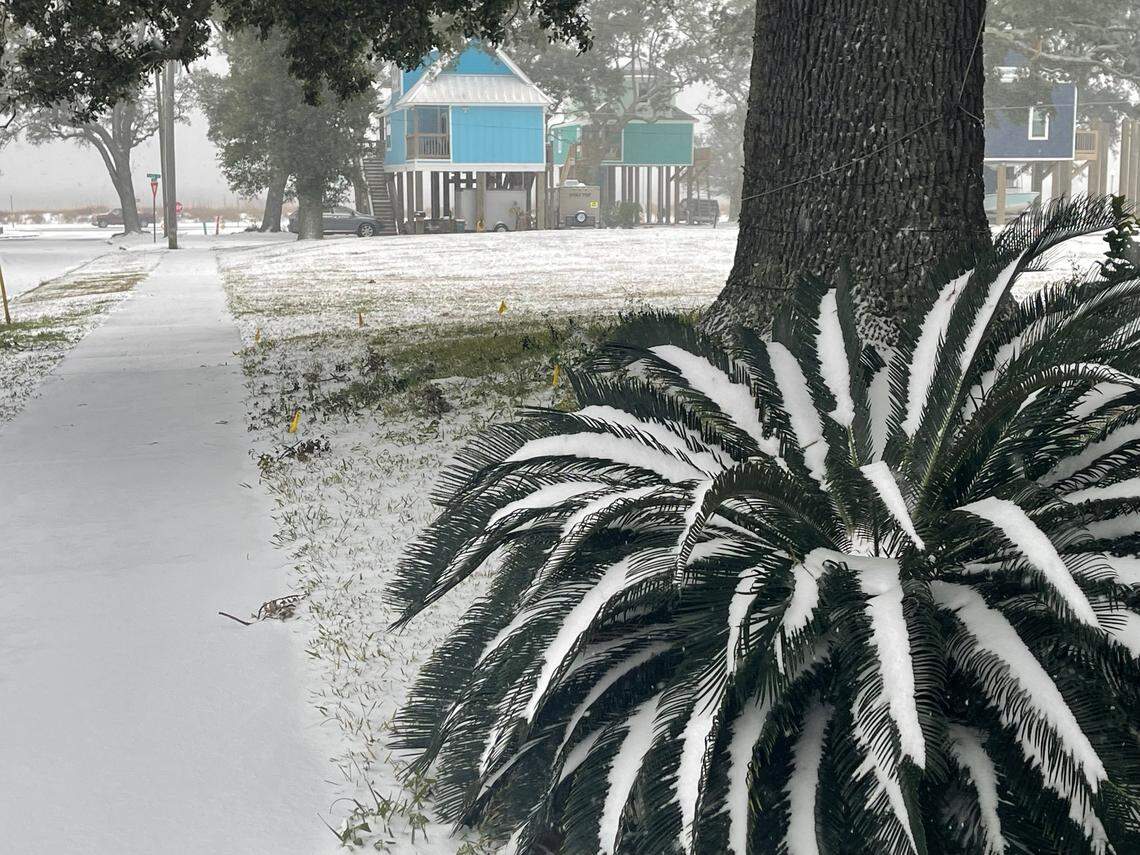 Snow is beginning to accumulate two hours into Tuesday’s winter weather event in Biloxi.