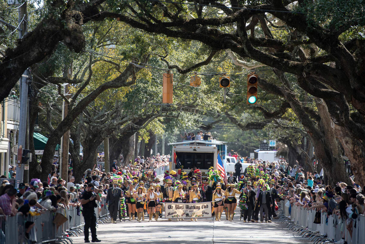 The Ole Biloxi Marching Club walks in the Ocean Springs Elks Club Mardi Gras Parade in Ocean Springs on Saturday, Feb. 15, 2025.