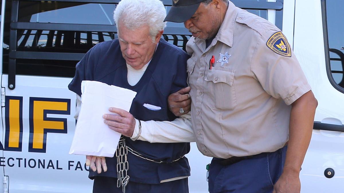 Dr. Albert Diaz of Ocean Springs is led June 7 into the federal courthouse in Hattiesburg, where he was sentenced to 3 1/2 years in prison in a health-care scheme that has now resulted in new indictments.