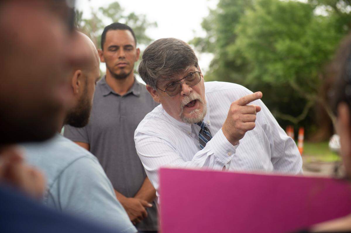 Rev. Blair Bradley, pastor for the Covenant of Peace Church in Harrison County, argues with protestors who are against removing library books outside the West Biloxi library in Biloxi where a library board meeting was being held on Monday, July 25, 2022. Bradley was one of two people who spoke to Biloxi City Council and asked them to consider removing children’s books that are inclusive of LGBTQ+ people.